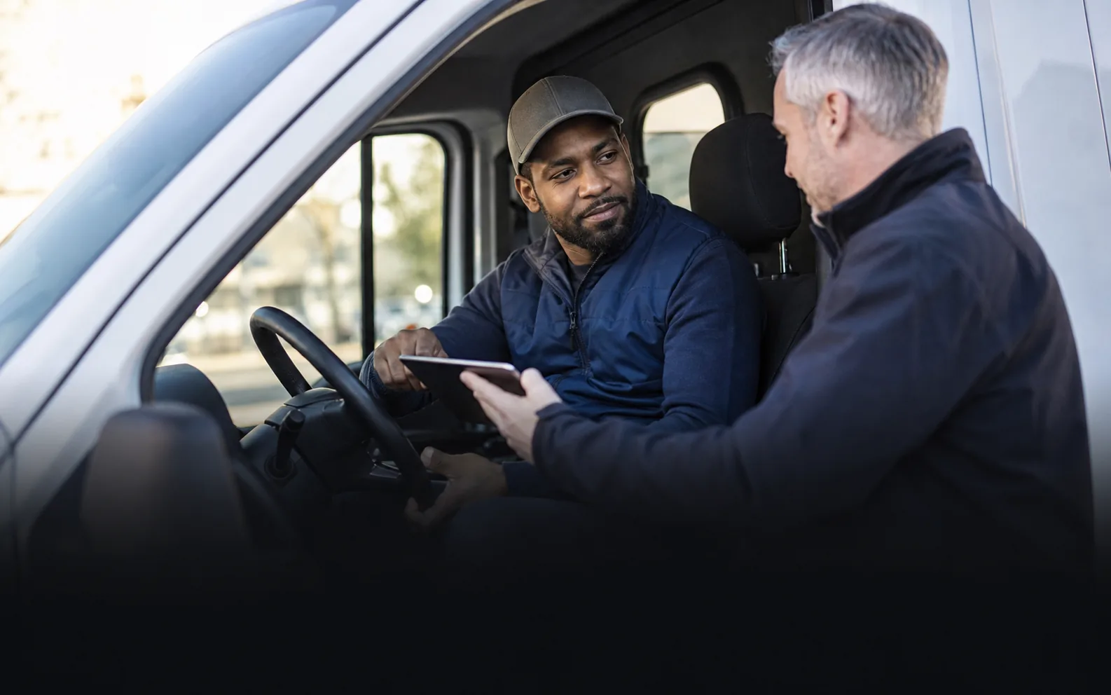 Driver and fleet supervisor reviewing safety performance