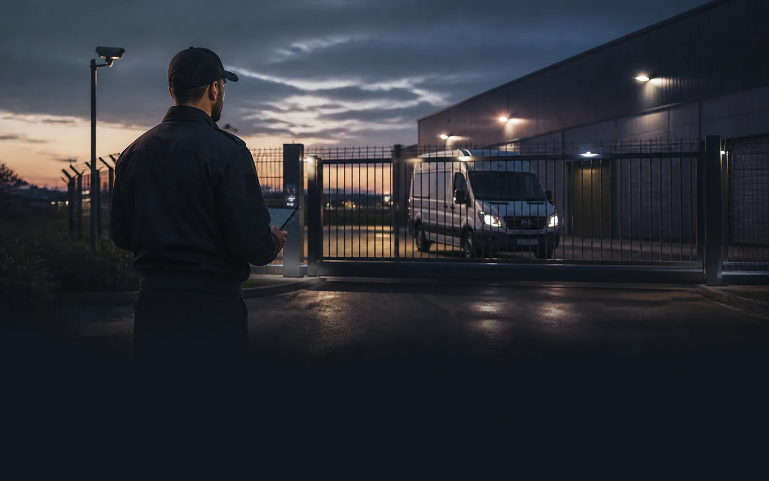 Secure fleet parking compound at dusk